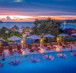 Poolside at Chanalai Garden Resort at sunset